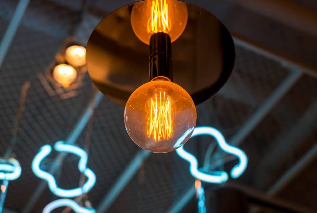 Glowing pendant bulb in a commercial interior