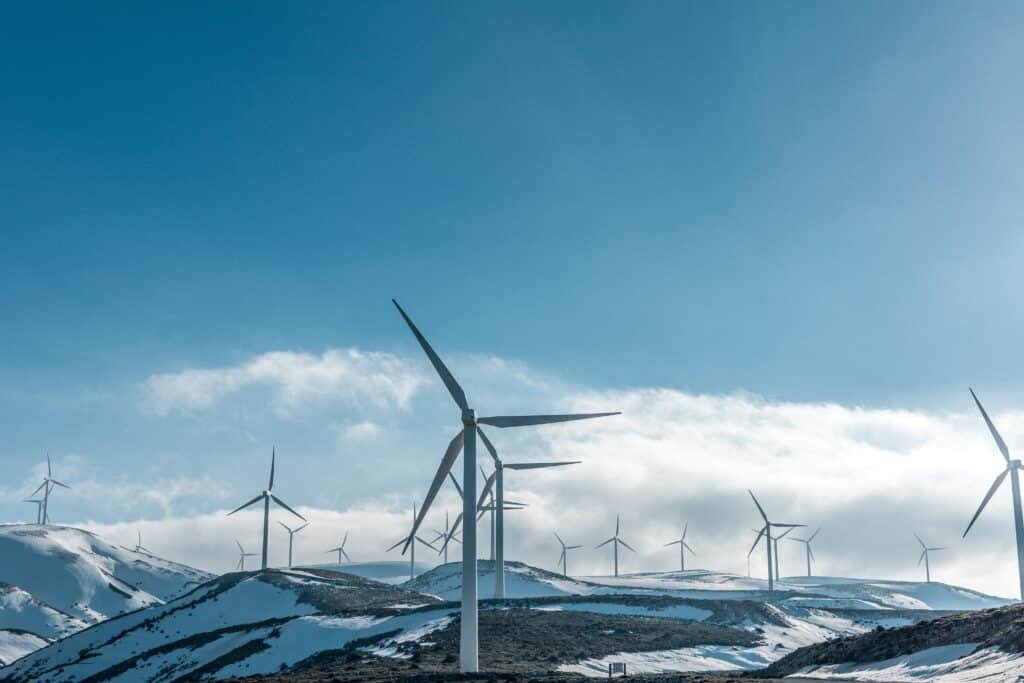 Wind turbines across a snow-covered landscape